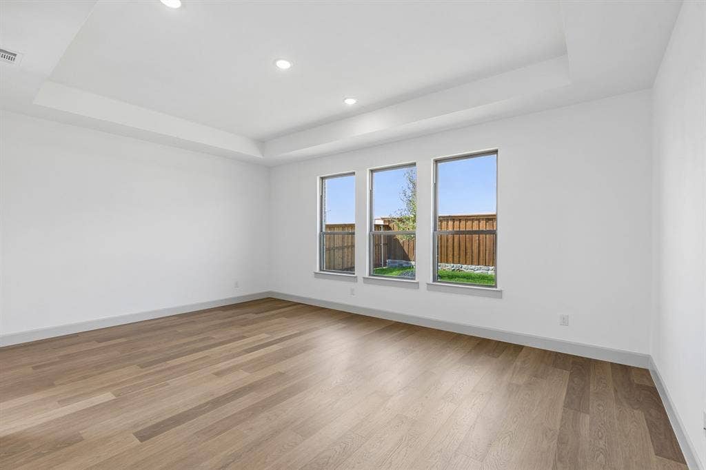 2612 Radiant Way, Celina, TX 75009 High ceilings, gorgeous flooring and oversized windows overlooking the beautiful back yard create a peaceful and relaxing owner's suite.