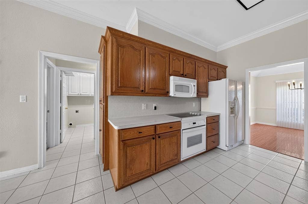 202 Northcreek Drive, Chandler, TX 75758 View of Kitchen with the Microwave and Slide In Electric Range