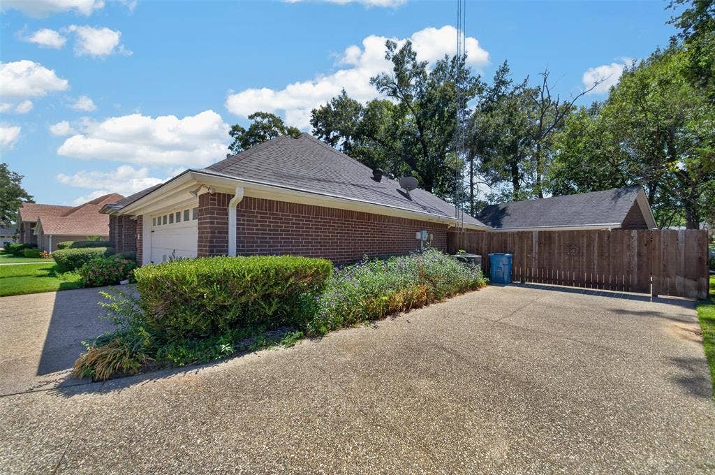 202 Northcreek Drive, Chandler, TX 75758 Additional Parking Area and the Gate hat leads to the addional parking for an RV or other use you may need. Also provides a good view of the gutters and down spouts.