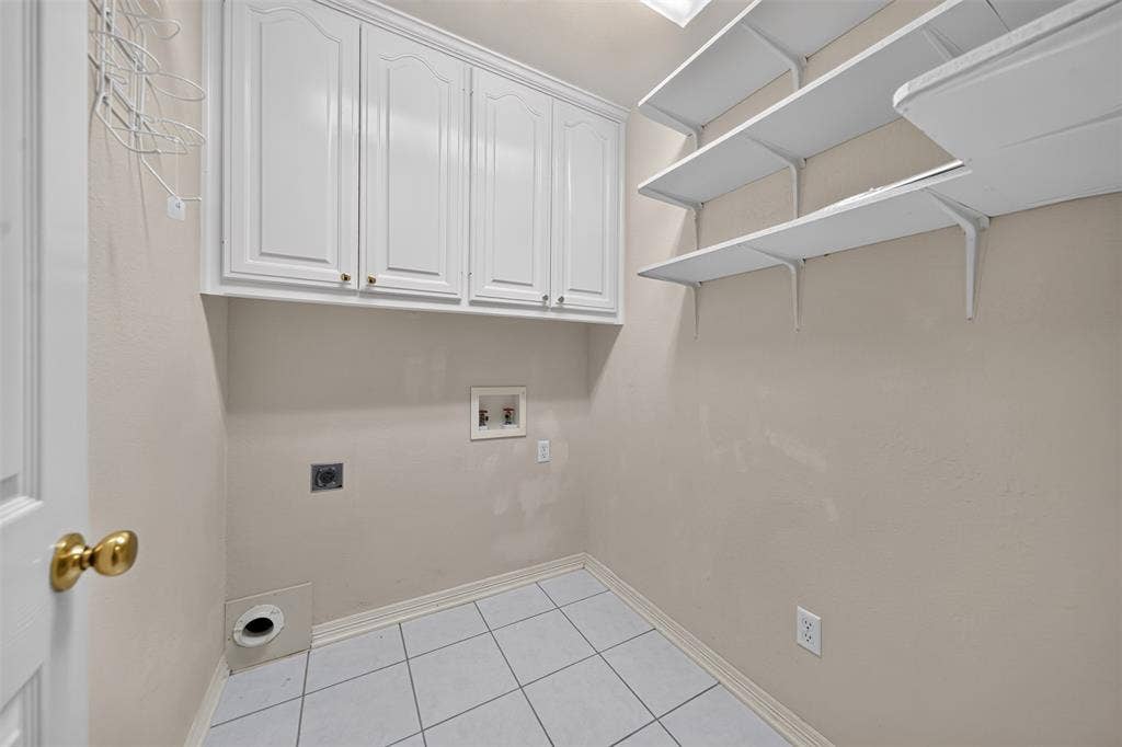 202 Northcreek Drive, Chandler, TX 75758 Laundry room features additional storage just off of the kitchen and garage.