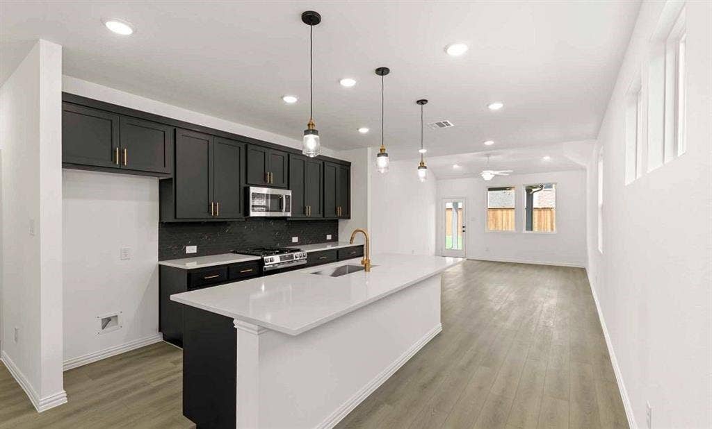 Open Kitchen-Living-Dining Room Representative Photo featuring the Noir Collection