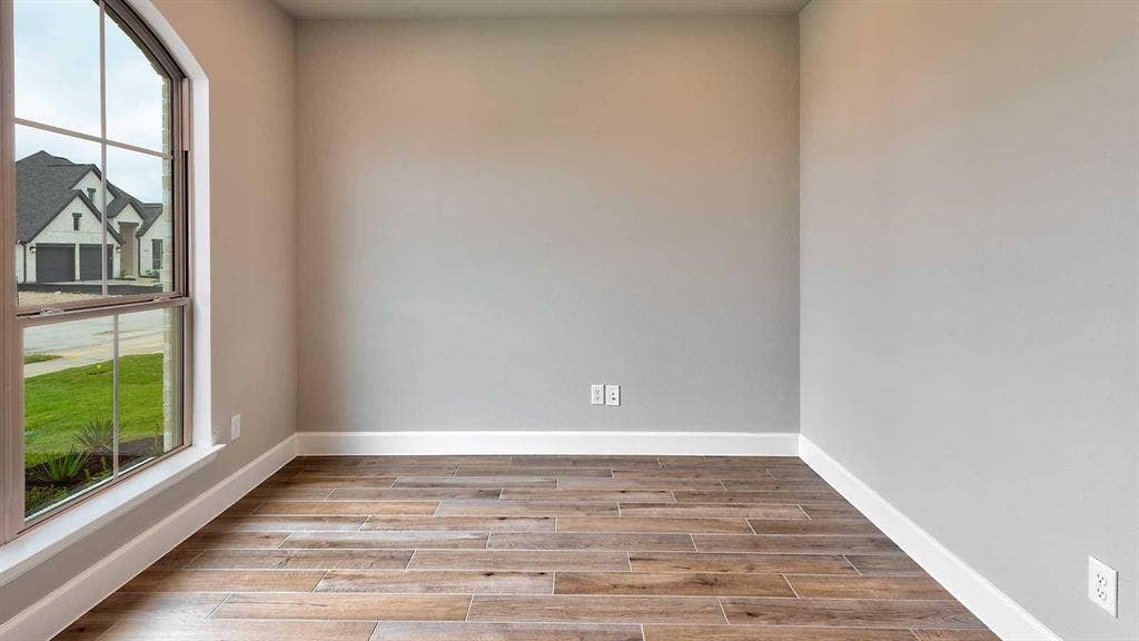 4237 Capstone Road, Midlothian, TX 76065 Wood-finish flooring, neutral wall tones, and white trim