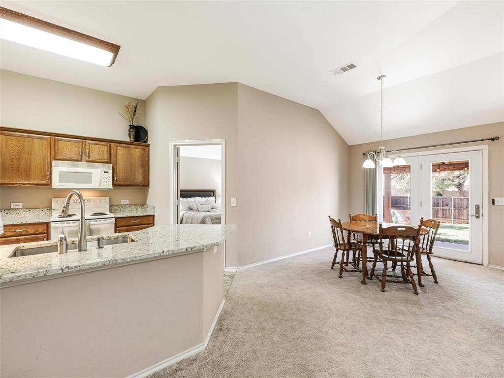 2109 Lilac Circle, McKinney, TX 75071 Granite counters set off this charming kitchen with oversized stainless sink