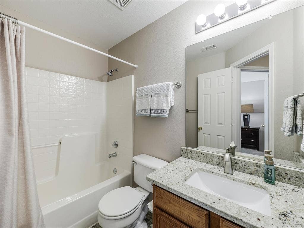 2109 Lilac Circle, McKinney, TX 75071 shared bath with granite counters