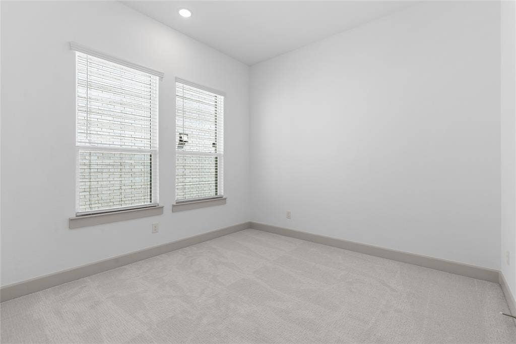 4524 Sunfish Lane, McKinney, TX 75071 White walls, recessed lighting, and light-toned carpeting