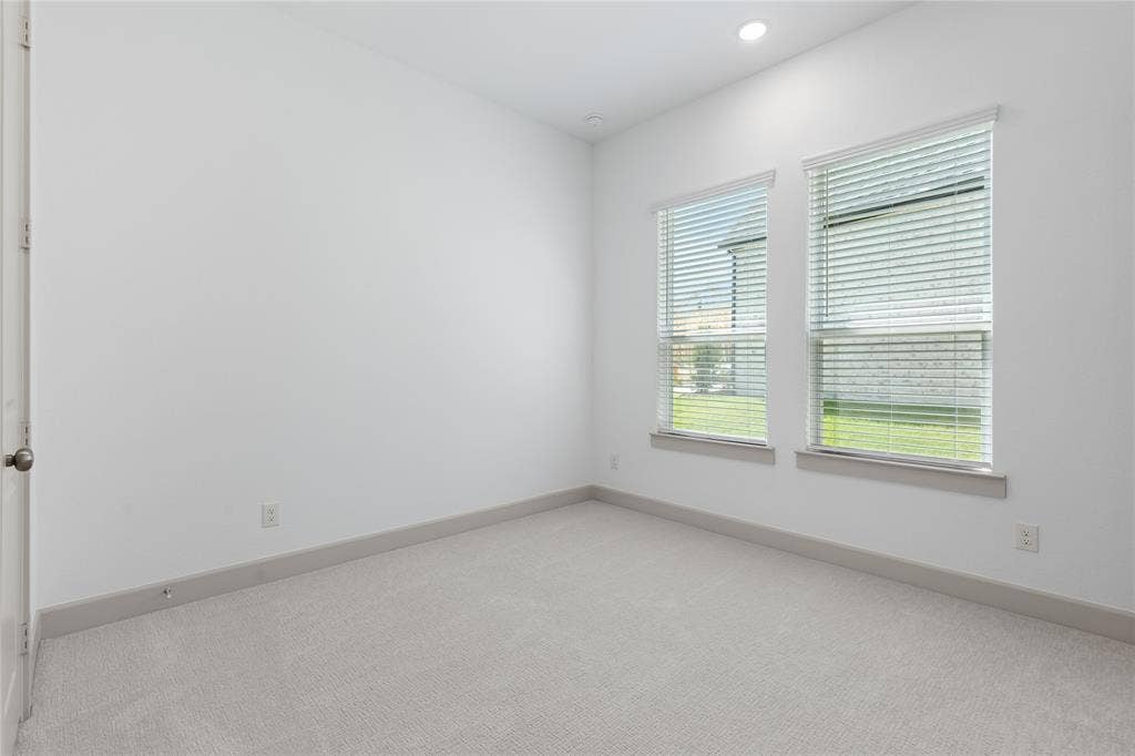 4524 Sunfish Lane, McKinney, TX 75071 Recessed ceiling lighting, white painted walls, two windows with blinds, gray carpeting, and gray trim work