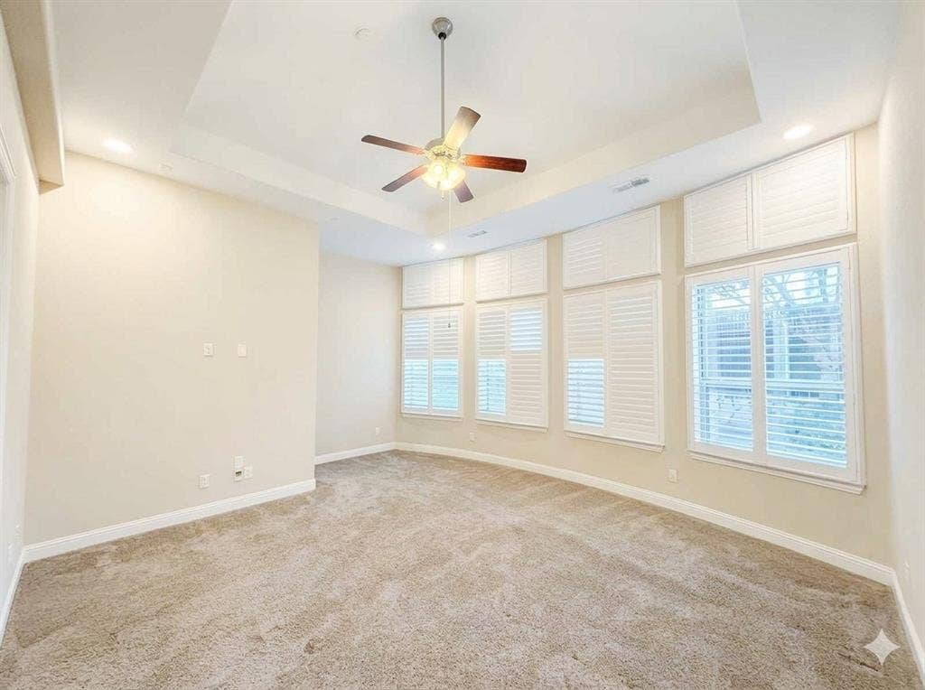 5917 Trantina Lane, Frisco, TX 75035 Recessed lighting, ceiling fan, tray ceiling, carpeted flooring, and window shutters