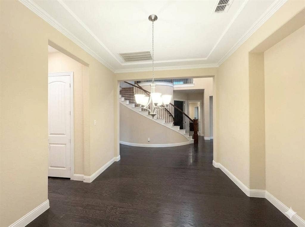 5917 Trantina Lane, Frisco, TX 75035 Dark wood-finish flooring with white trim