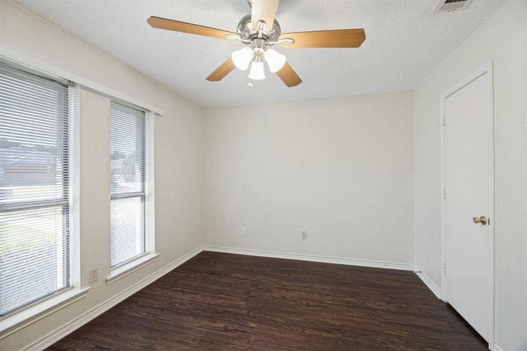 1721 Guildford Street, Garland, TX 75044 Secondary bedrooms all feature a ceiling fan and nice flooring!