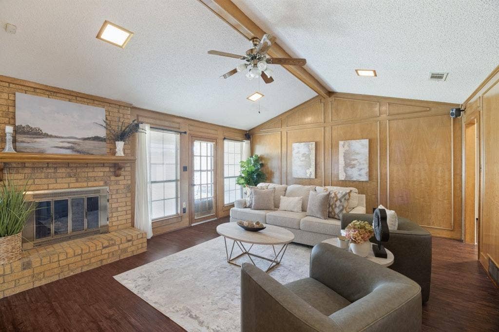 1721 Guildford Street, Garland, TX 75044 Cozy gas fireplace with gas logs and a patio door leading to the backyard.