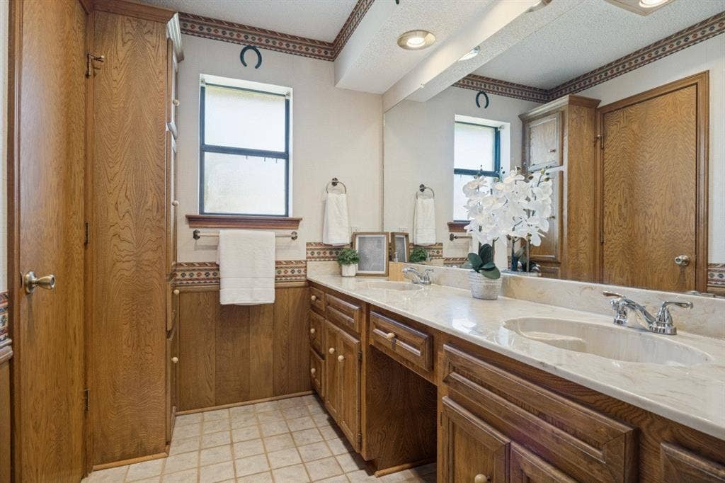 1721 Guildford Street, Garland, TX 75044 Primary bathroom features two sinks and a shower.