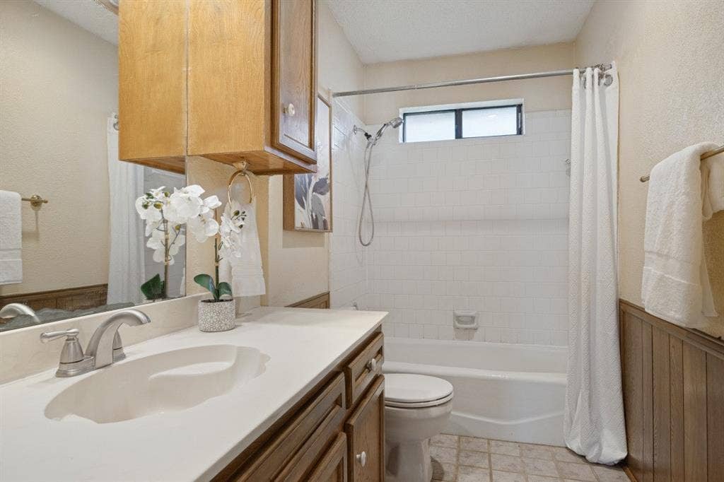 1721 Guildford Street, Garland, TX 75044 The hall bathroom is conveniently located between bedrooms 2 and 3.