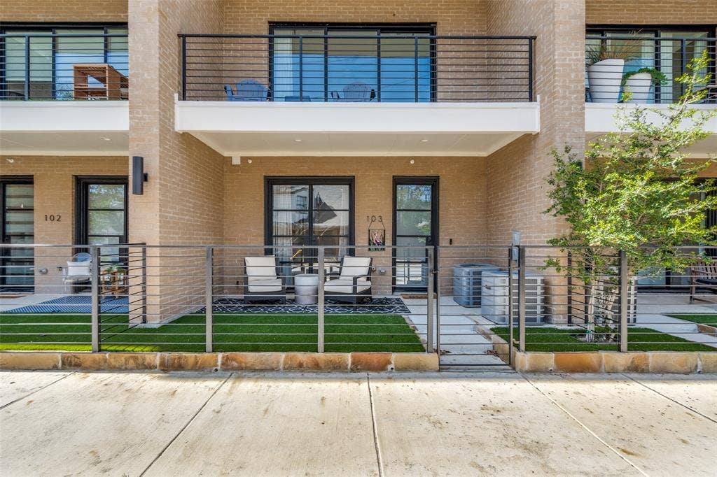 805 Pavillion Street, #103, Dallas, TX 75204 Brick facade with private patio featuring artificial turf