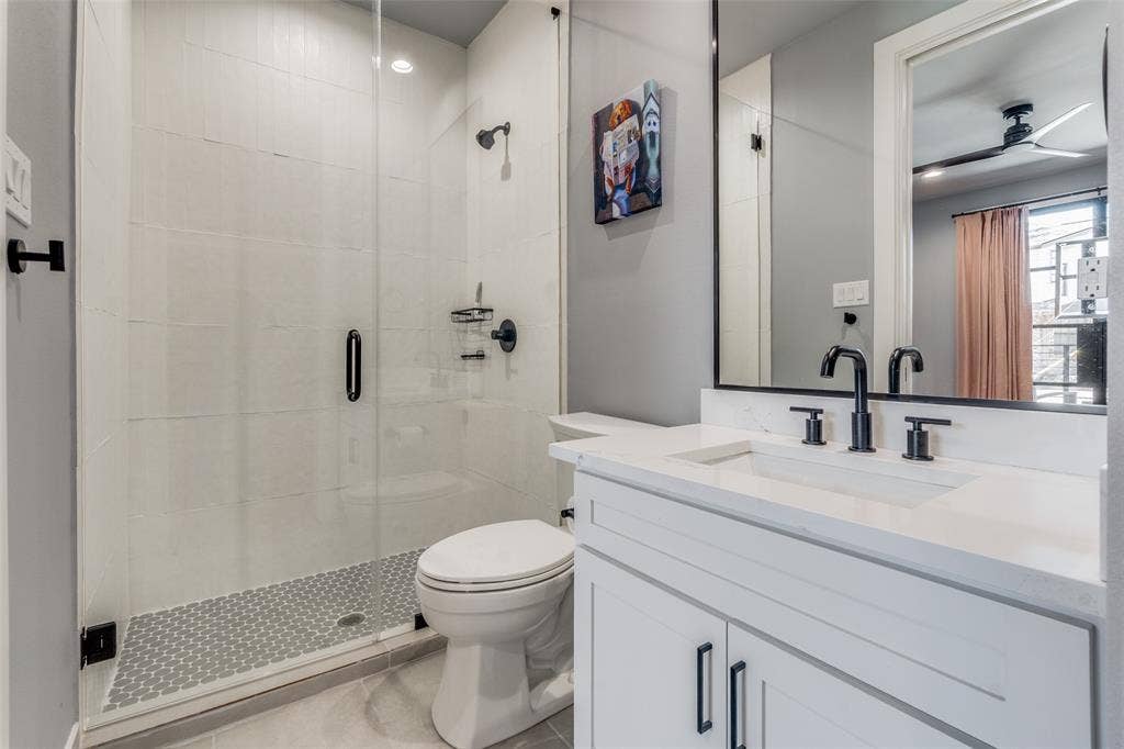 805 Pavillion Street, #103, Dallas, TX 75204 Walk-in shower with clear glass enclosure and mosaic tile floor