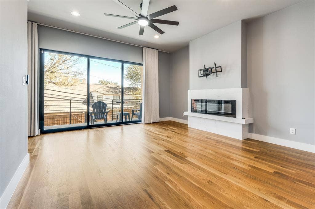 805 Pavillion Street, #103, Dallas, TX 75204 Wood-finish flooring, recessed lighting, and a ceiling fan