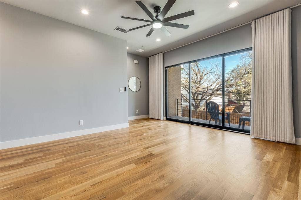 805 Pavillion Street, #103, Dallas, TX 75204 Wood-finish flooring, recessed lighting, and a ceiling fan