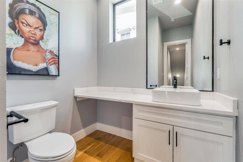 805 Pavillion Street, #103, Dallas, TX 75204 White rectangular vessel sink with a matte black faucet, set on a white countertop with integrated cabinetry