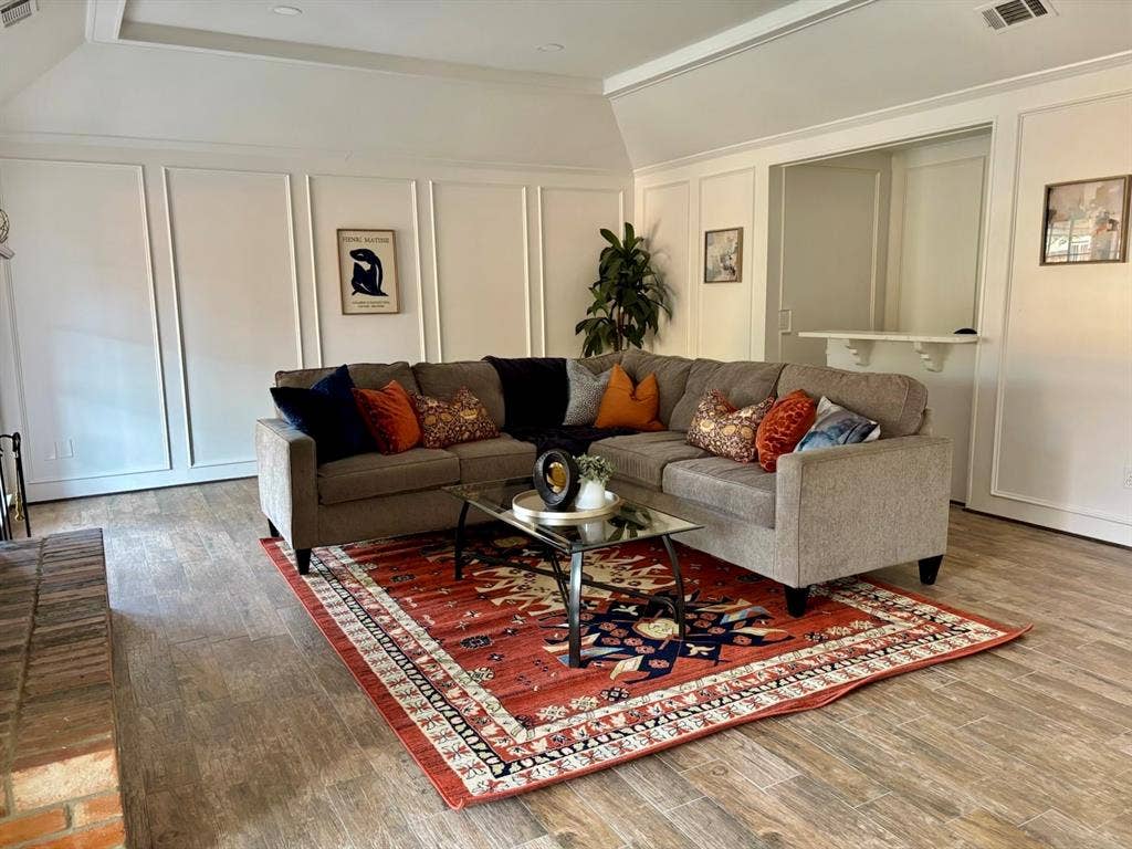 3713 San Juan Circle, Plano, TX 75023 Vaulted ceiling, wood-finish flooring, wainscoting, brick hearth, and pass-through opening