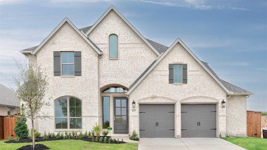4237 Capstone Road, Midlothian, TX 76065 Brick exterior with dark gray shutters, an arched entry, a two-car garage, and established landscaping