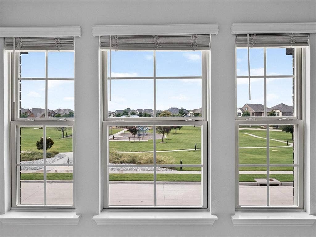 6504 Dynamite Drive, McKinney, TX 75070 Triple windows featuring grid patterns and integrated blinds