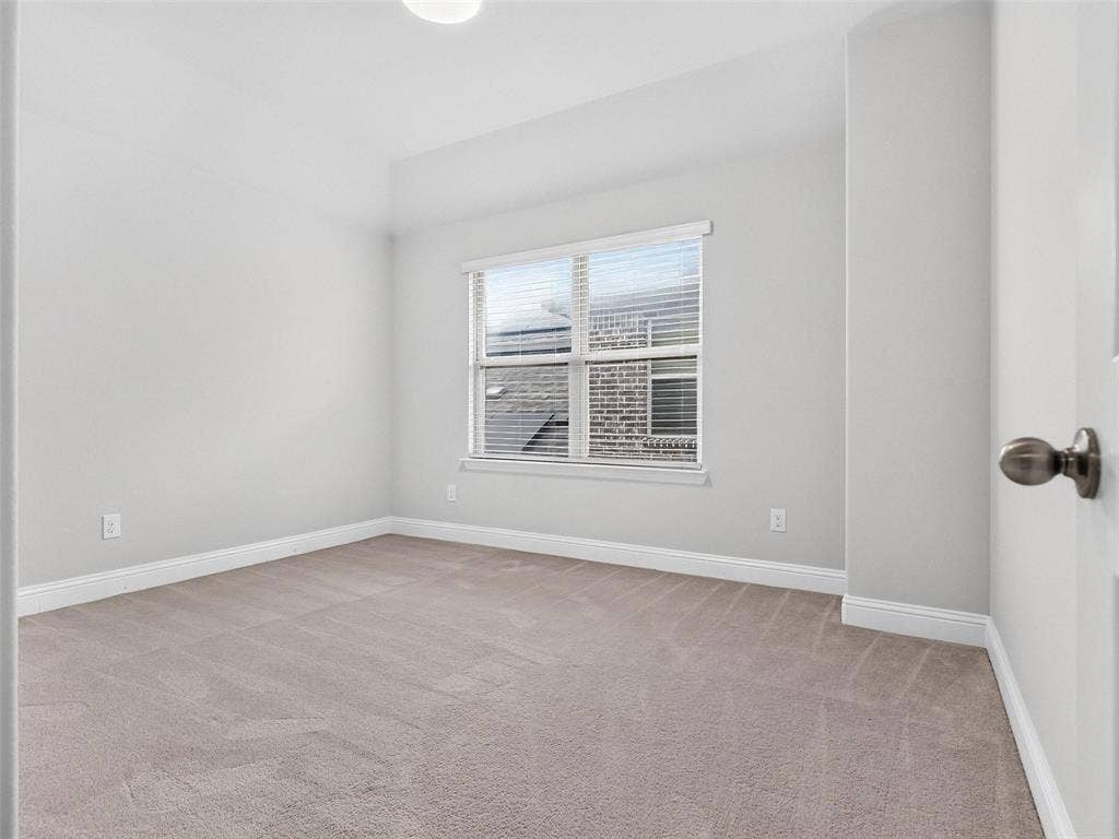 6504 Dynamite Drive, McKinney, TX 75070 Neutral wall color, carpeted flooring, window with blinds, and white trim