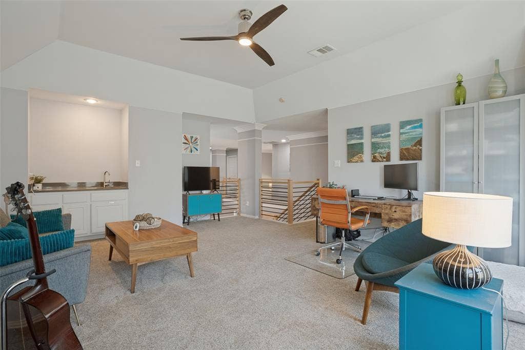 Game room with wet bar.