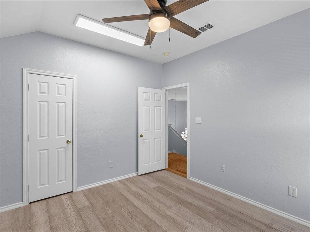 7302 San Carlos Drive, Rowlett, TX 75089 Vaulted ceiling featuring a ceiling fan, wood-finish flooring, recessed lighting, and crisp white trim