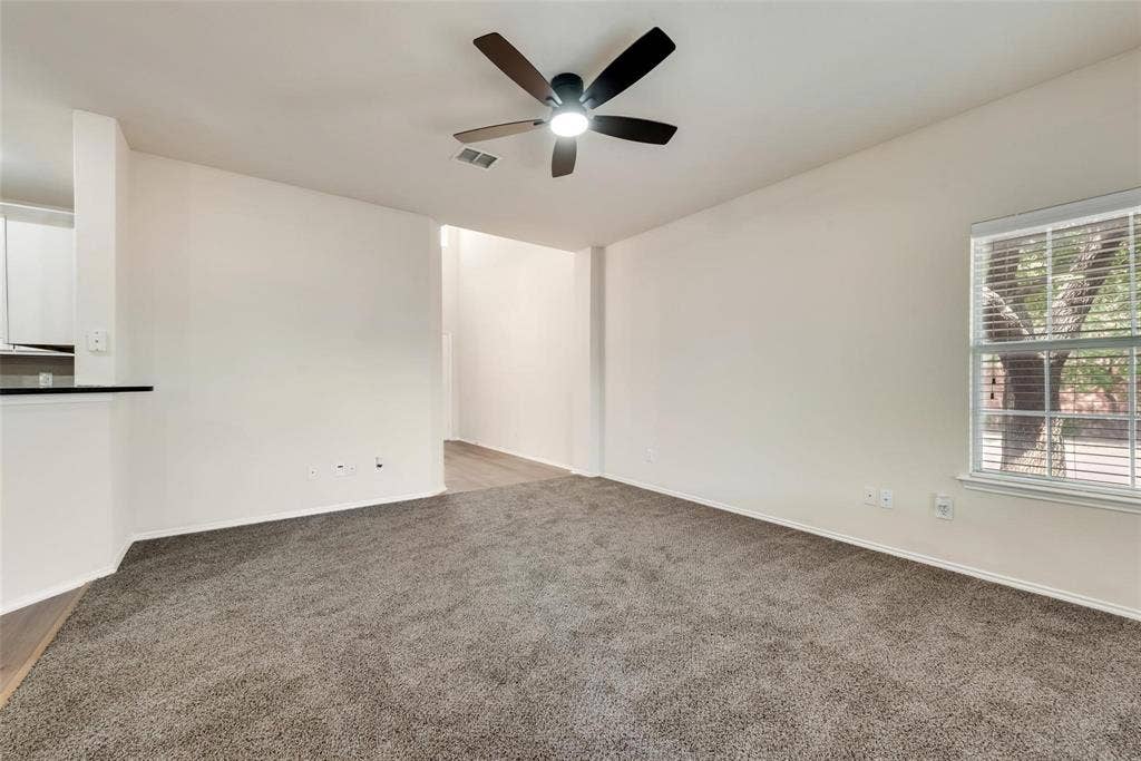 4541 Woodsboro Lane, Plano, TX 75024 Spacious room featuring carpet flooring, a ceiling fan, and a window with horizontal blinds
