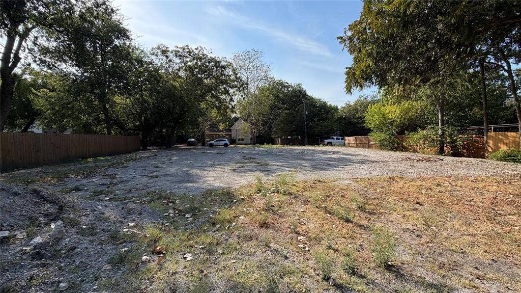 307 S Rike Street, Farmersville, TX 75442 Expansive lot featuring mature trees and a perimeter fence