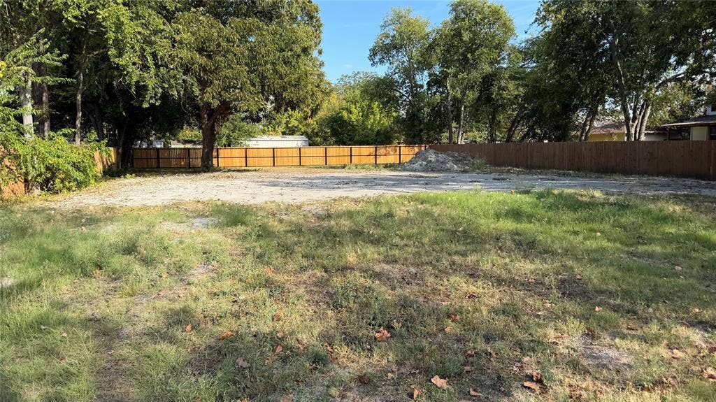 307 S Rike Street, Farmersville, TX 75442 Expansive lot with mature trees and perimeter fencing