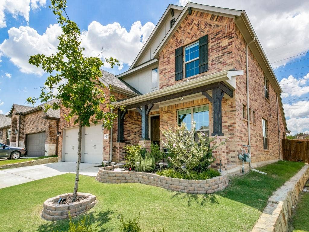 Custom landscaping & one of the most pristine lawns in the neighborhood!