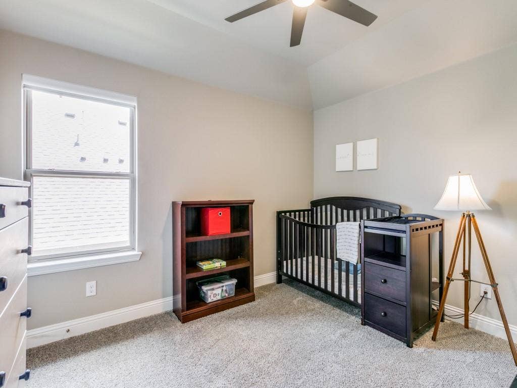 Another spacious bedroom upstairs with walk-in closet and access to walk-in attic space
