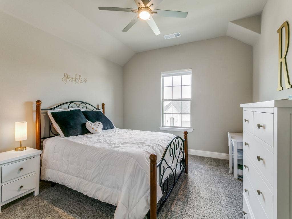 Another bedroom with walk-in closet and access to walk-in attic space