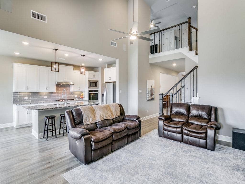 Spacious living area with sweeping ceilings and open concept