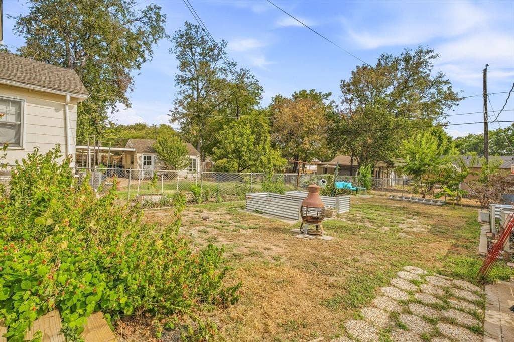 Backyard with raised garden beds.