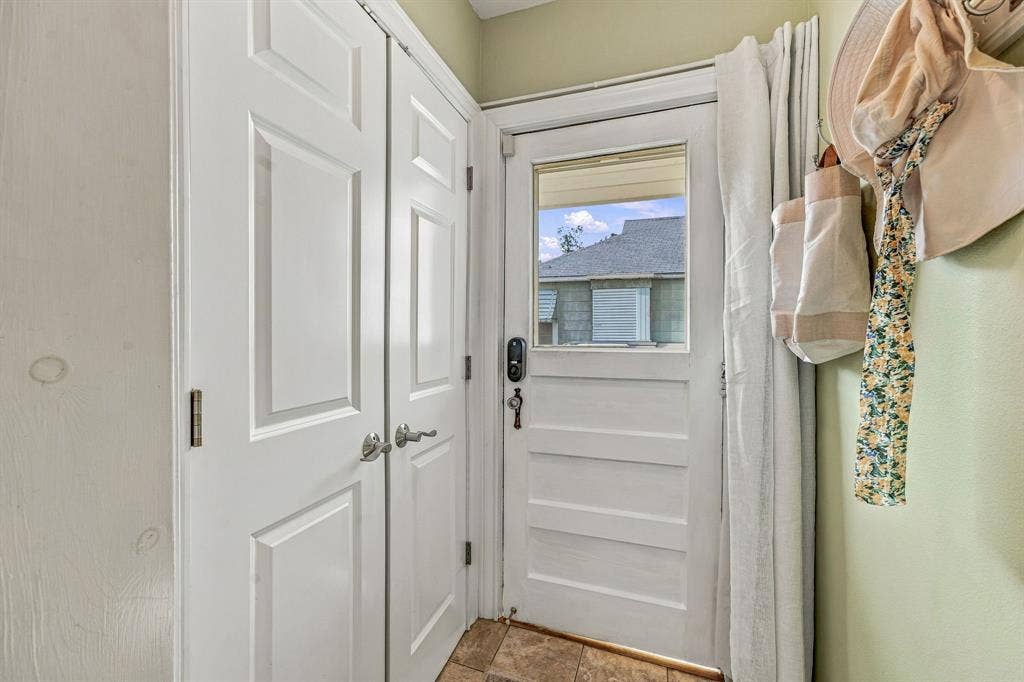 Kitchen pantry and door to backporch.