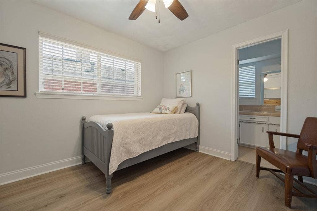 Bedroom 3 has a ceiling fan, LVP flooring, walk-in closet, & is adjacent to the 2nd bathroom.