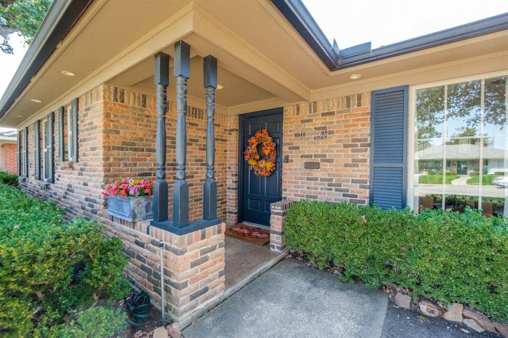 Welcoming covered entrance to this beautiful, well-maintained home.