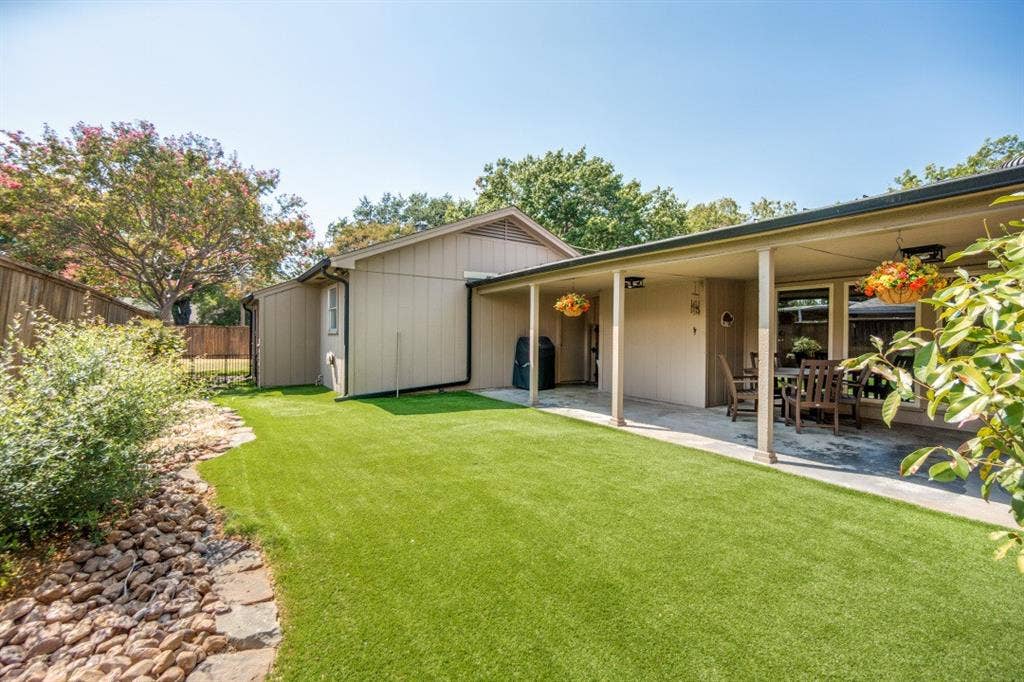 Green year-round with synthetic turf beside the big patio. Morning sun & afternoon shade.