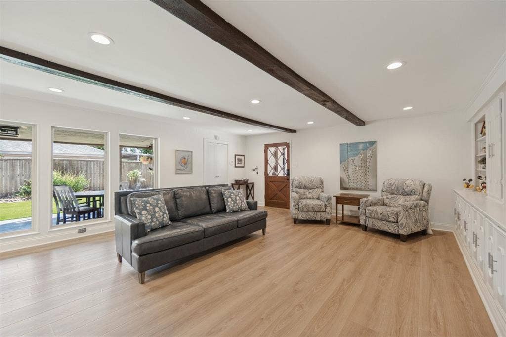 Family Rm looks out to Covered Patio & yards; has extra storage room (8x6) behind white doors, back door to garage & 4 more parking spaces for RV, boat, & cars.
