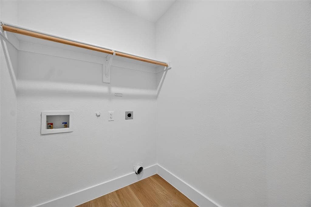 705 N Jordan Road, McKinney, TX 75071 Built-in shelving with hanging rod, laundry hookups, and wood-finish flooring