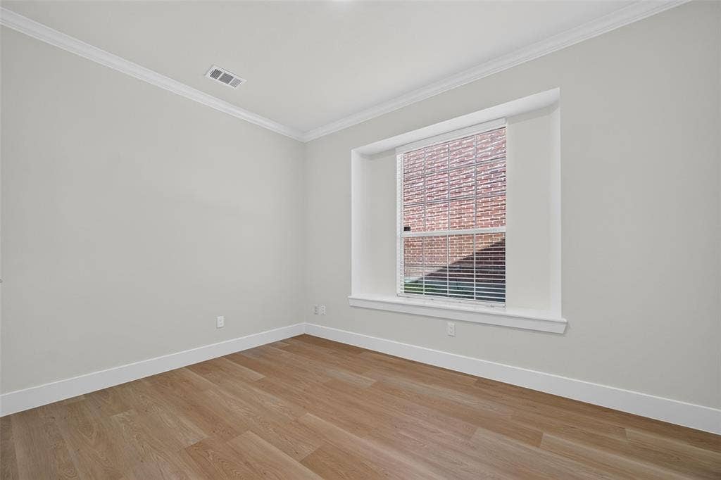 705 N Jordan Road, McKinney, TX 75071 Recessed window with white blinds, wood-finish flooring, white crown molding, and neutral wall tones