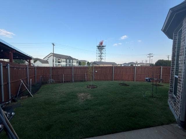 7610 Graystone Drive, Sachse, TX 75048 Backyard featuring a privacy fence, mature landscaping, and a covered patio structure