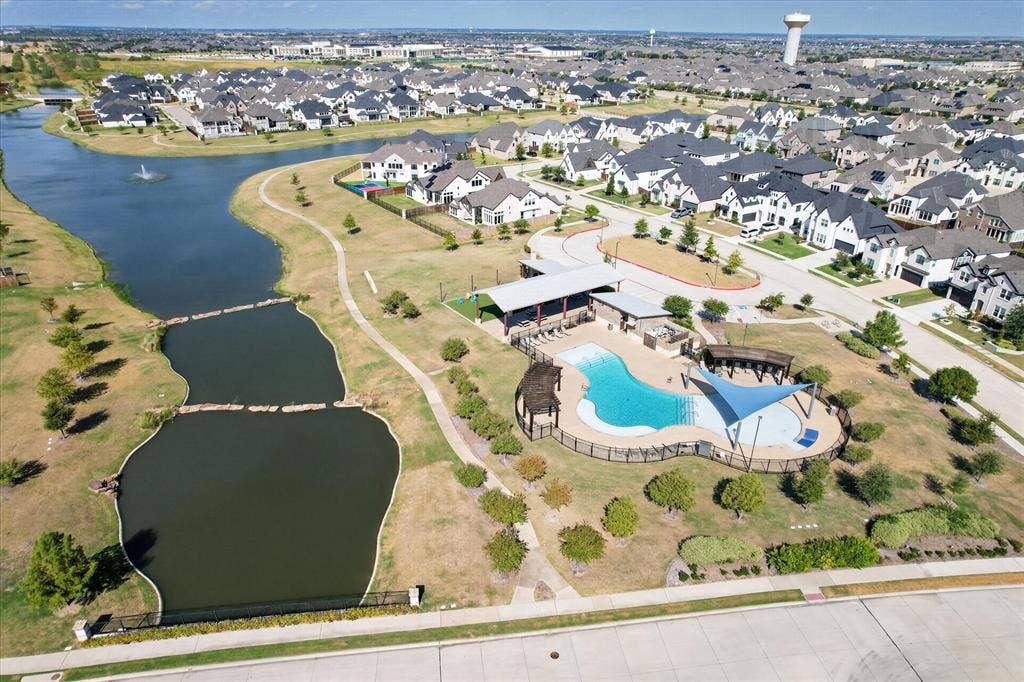 Community amenities featuring a large swimming pool, covered outdoor lounge area, and a shaded children's pool