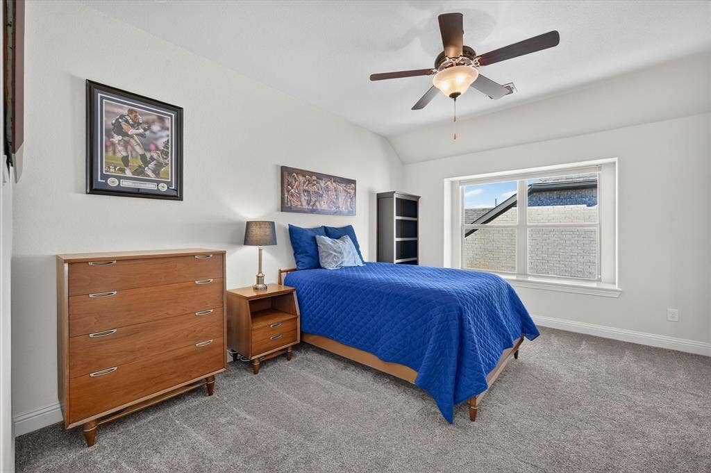 Recessed window, ceiling fan with integrated lighting, and carpeted flooring