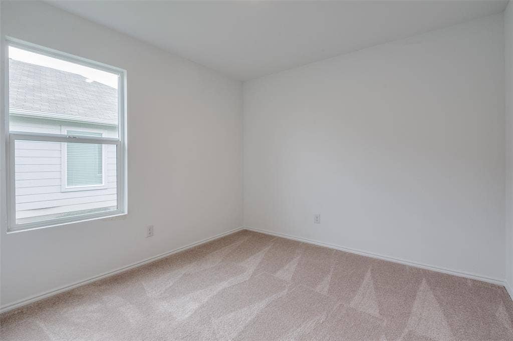 1708 Sims Street, McKinney, TX 75071 View of carpeted empty room