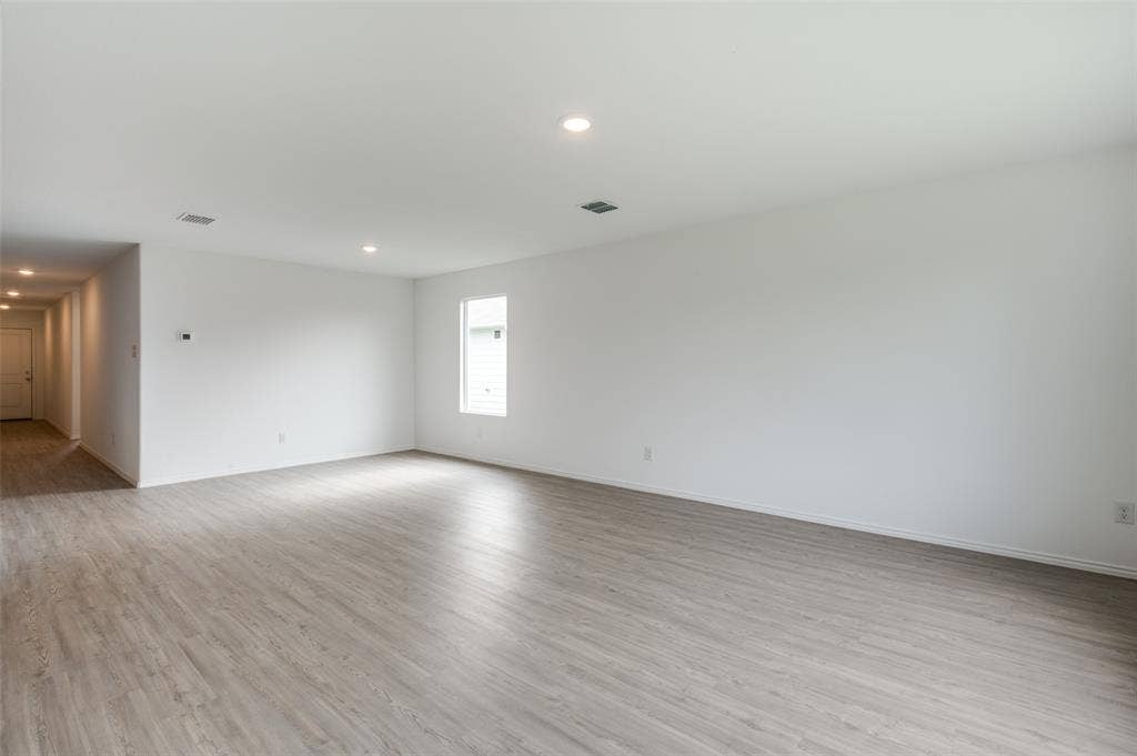 1708 Sims Street, McKinney, TX 75071 Unfurnished room with light wood-type flooring