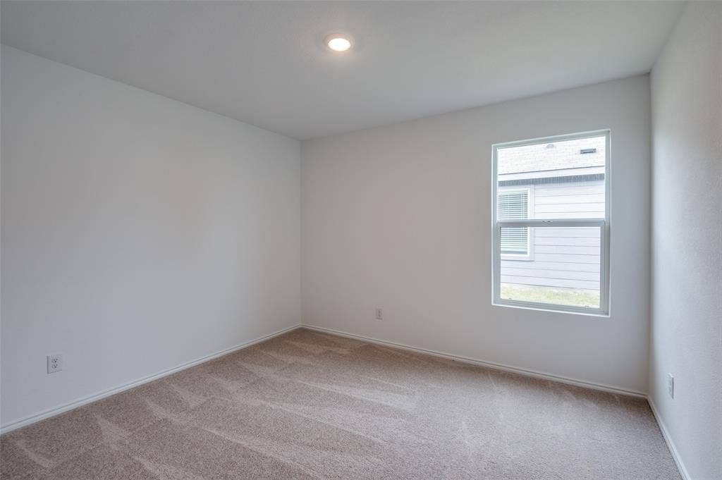 1708 Sims Street, McKinney, TX 75071 View of carpeted spare room