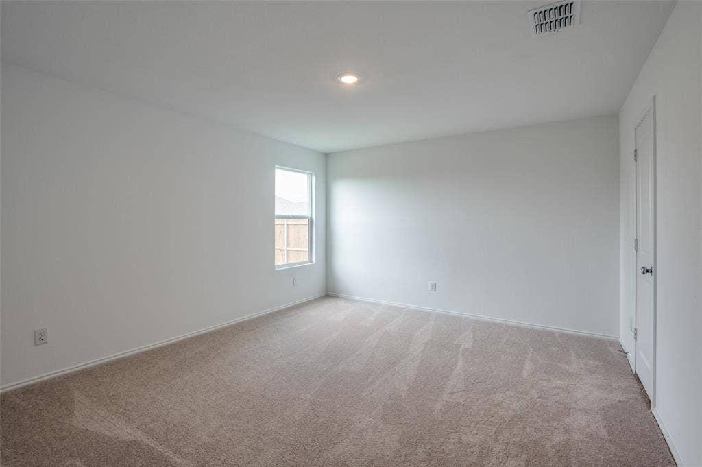 1708 Sims Street, McKinney, TX 75071 Unfurnished room featuring light colored carpet