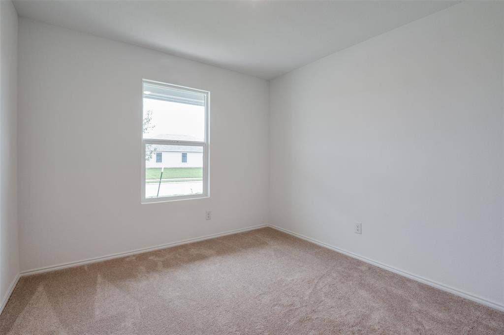 1708 Sims Street, McKinney, TX 75071 View of carpeted spare room